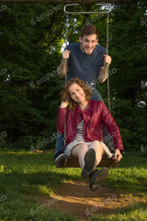 Preview: Girl Boy, Couple Swing , Looking At Camera.