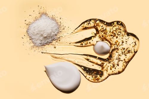 Preview: Textures of different cosmetic products on a gold background.