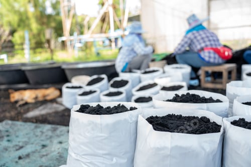 Preview: Prepare the soil for planting in a white bag. Prepare the Organic Soil bare soil garden. humus