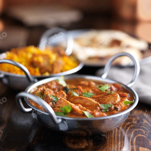 Preview: table with indian food and chicken curry in balti dishes