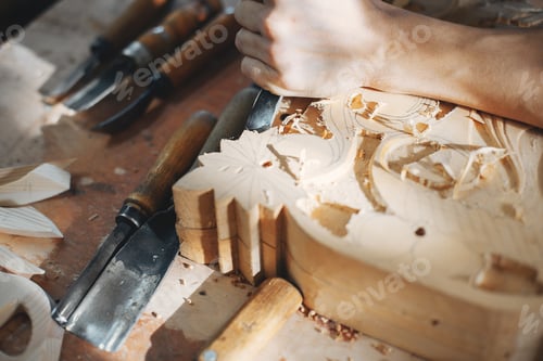 Preview: The carpenter works with a tree
