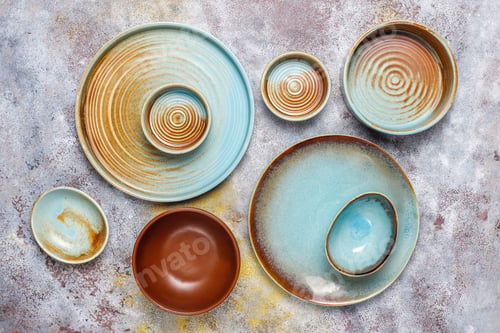 Preview: Different ceramic empty plates and bowls.