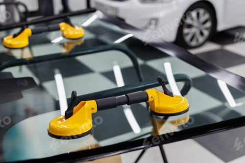 Preview: Suction pads for car windshield installing in workshop.