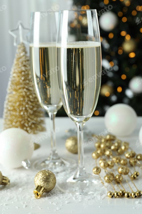 Preview: Concept of New Year celebration with glasses of champagne