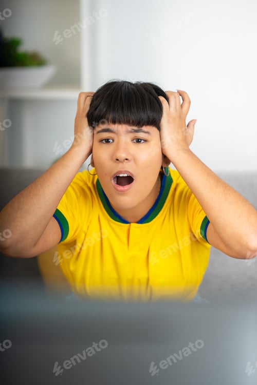 Preview: Woman cheering for her team watching a soccer game