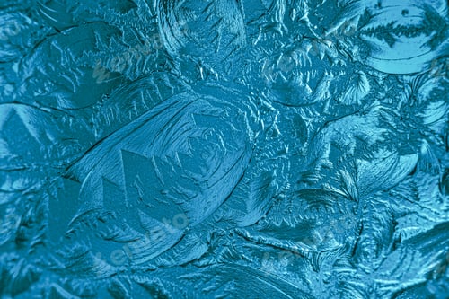 Preview: Teal texture. Shot through a glass window. Raised pattern in a glass door insert. Art Glass