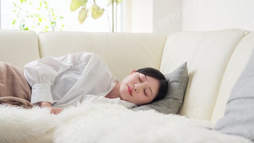 Preview: Asian woman taking a nap in the afternoon