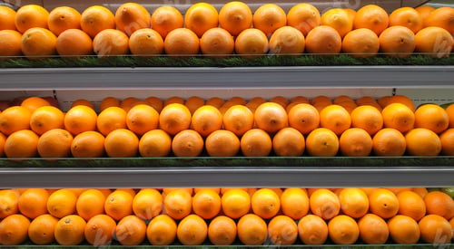 Preview: Orange displayed at supermarket aisle.