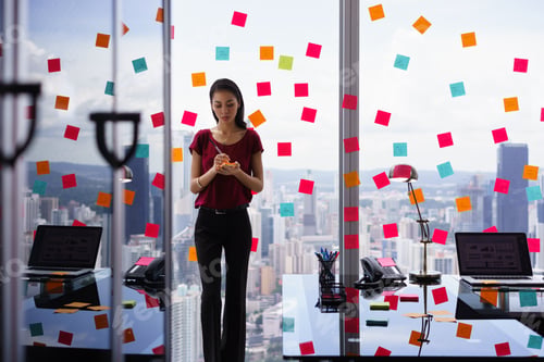 Preview: Busy Person Writing Many Sticky Notes On Large Window