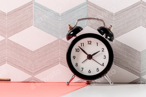 Preview: Vintage background with retro alarm clock on table