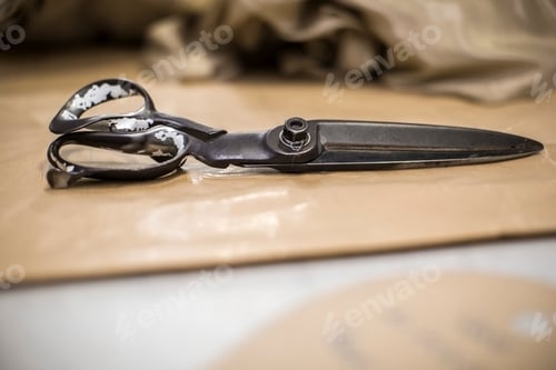 Preview: Scissors on table in clothing factory