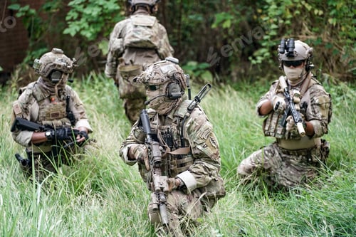 Preview: Soldier in full US MARSOC armed with assault rifle run through the abandoned building. Military