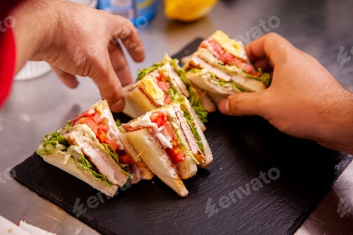 Preview: Chef making sandwich desing on stone plate