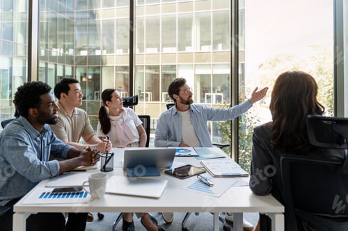 Preview: Business team discussing during a meeting in a modern office