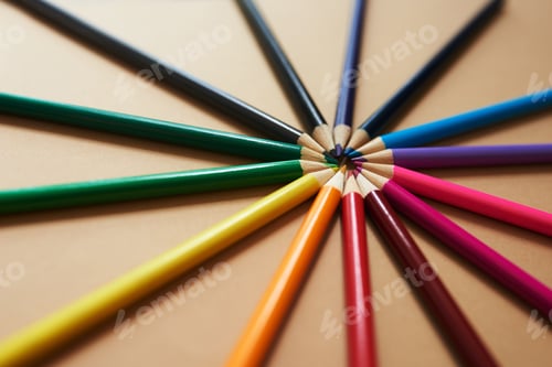 Preview: Studio shot of different coloured pencils against a brown background