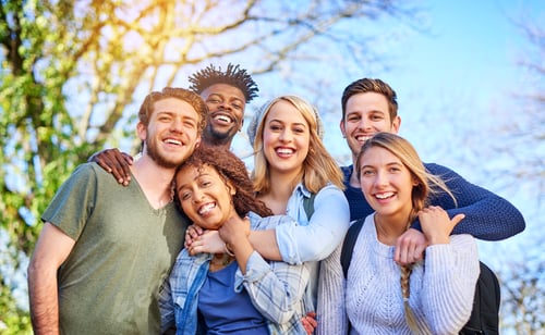 Preview: Portrait of a group of diverse students hanging out together outside on campus