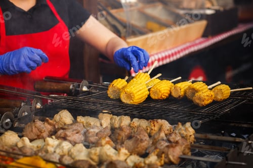 Preview: Delicious vegetables grilling on open grill, outdoor kitchen