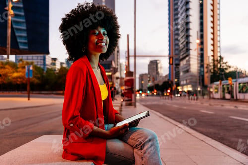 Preview: Beautiful young black woman outdoors in the city