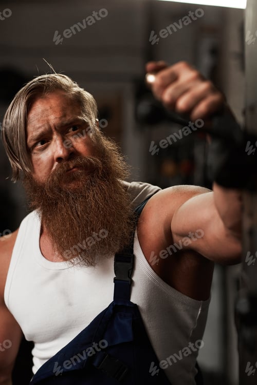 Preview: Dirty athletic worker in workshop