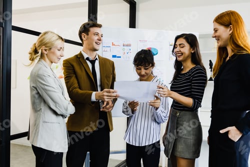 Preview: Diverse business team having a meeting in a creative workplace