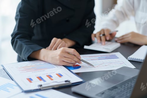 Preview: Close-up view of businessman analyzing graphs and organization chart explain to the meeting the fut