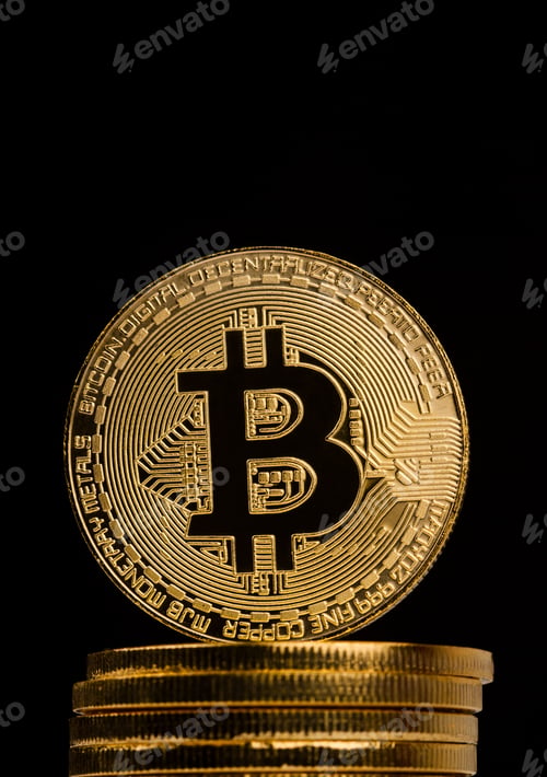Preview: closeup of golden bitcoin on pile of metallic coins