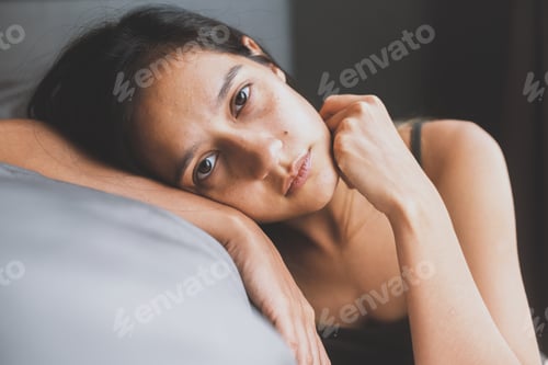 Preview: Young girl is liying down on the bed, boring