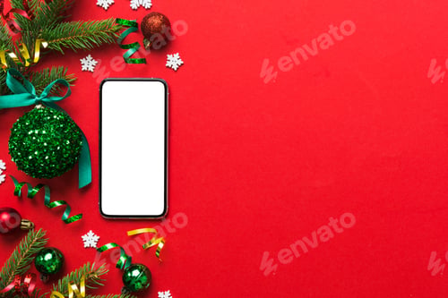 Preview: Digital phone mock up with rustic Christmas decorations for app presentation top view