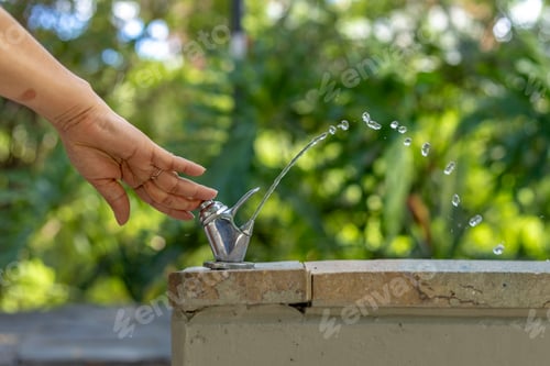 Preview: Hand Pressing Outdoor Drinking Fountain in Park