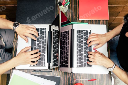 Preview: Overhead view of a couple working with laptop
