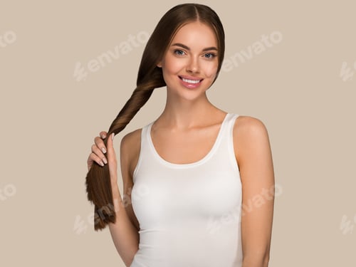 Preview: Woman Smiles Holding Her Long Braided Brown Hair