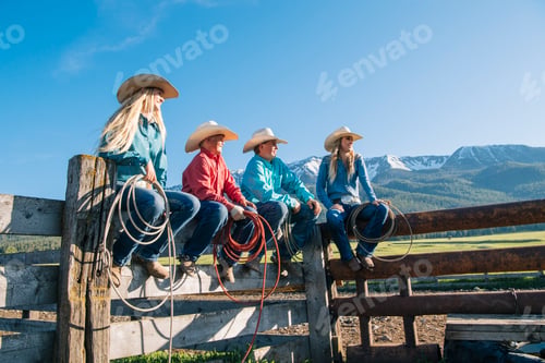 Preview: Cowboys and cowgirls on fence, looking away, Enterprise, Oregon, United States, North America