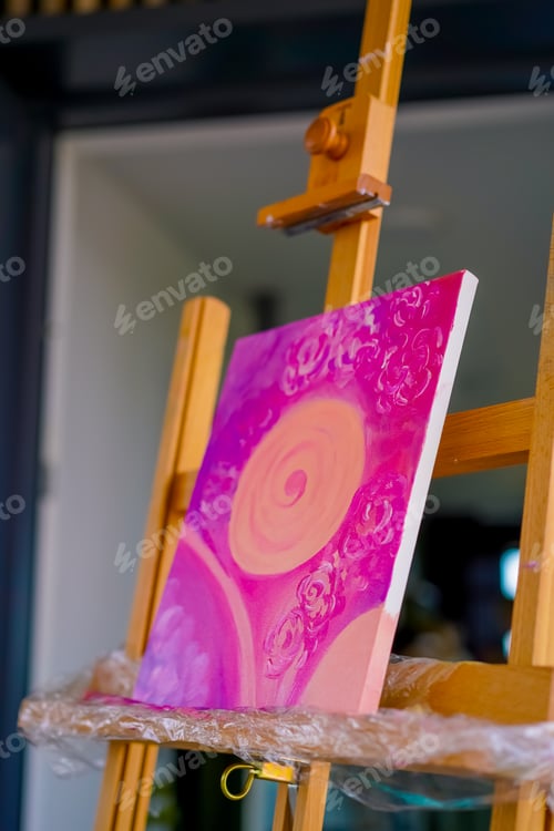 Preview: A close-up of painting standing on an easel in a studio for painting the concept of love of fine art
