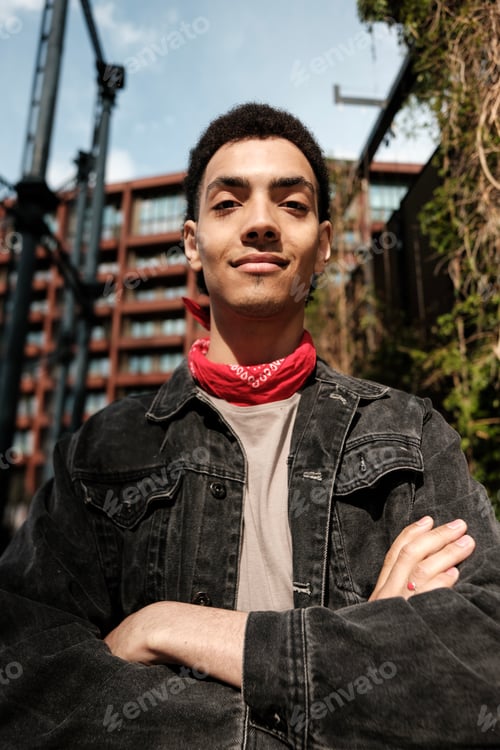 Preview: Young man wearing red bandana and denim jacket posing with confidence