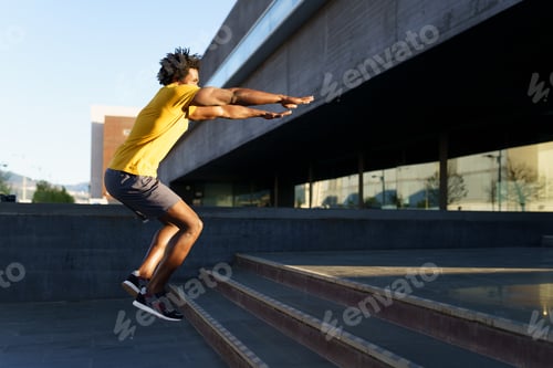 Preview: Black man doing squats with jumping on a step
