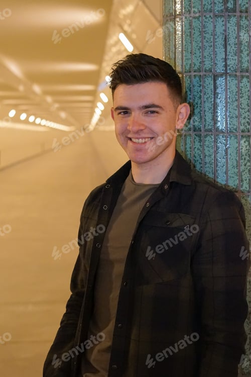 Preview: a young man standing in a tunnel