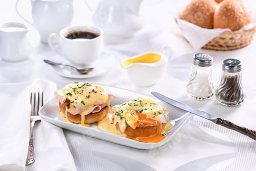 Preview: Breakfast. Best Eggs Benedict - fried English bun, ham, poached eggs and delicious Hollandaise but
