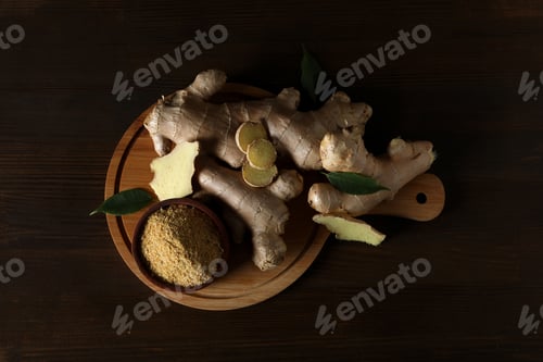 Preview: Fresh ginger root with ginger powder in a bowl