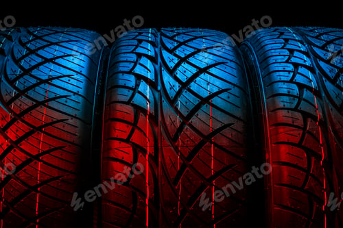 Preview: New tyres background. Car tyres close up