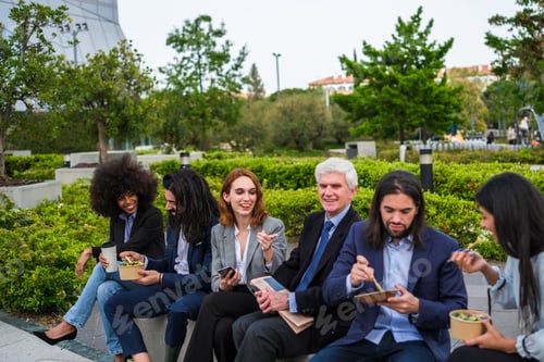 Preview: Group of coworkers taking a break in business district