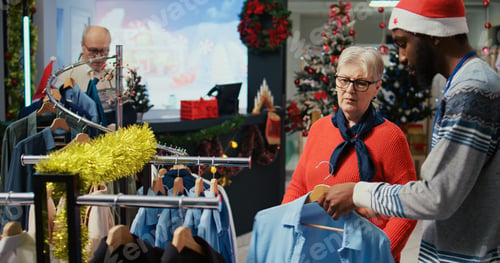 Preview: Employee assisting older client in store