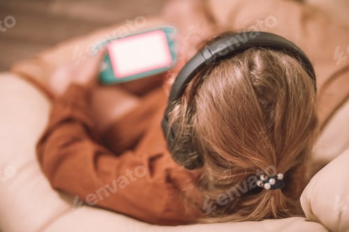 Preview: little girl listening to music on the phone, surfing the internet, playing games, making a videocall