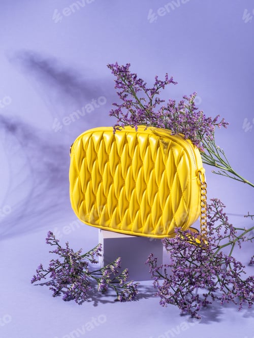 Preview: Yellow fashion lady handbag with purple flowers on monochrome background