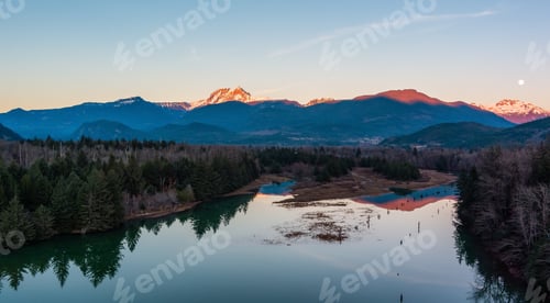 Preview: Canadian Mountain Landscape, peaceful river with green trees. Sunny Sunset.