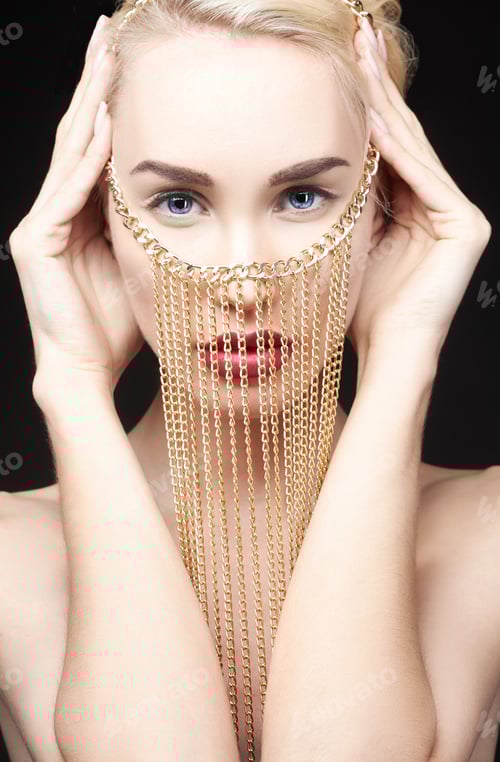 Preview: Fashion beauty Nude blonde woman on a light background. Woman with jewels on the arms and neck