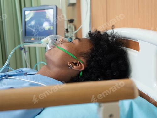 Preview: At hospital intensive care unit patient in coma lay on bed unconsciousness breathing to oxygen mask