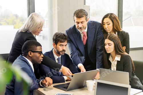 Preview: Diverse colleagues analyzing data in office