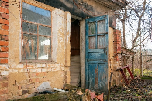 Preview: Retro-styled abandoned brick barn or farmhouse with open blue doors and big window.