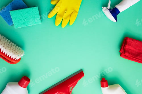 Preview: Cleaning products background, detergent bottles and tools, copy space