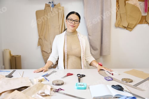 Preview: Beautiful woman designer in the atelier at the workplace
